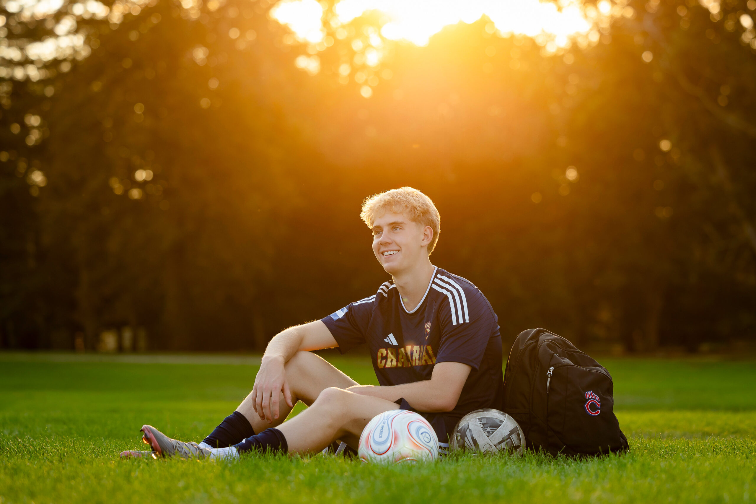 Golden hour senior portrait session in Denver with Chaparral soccer gear