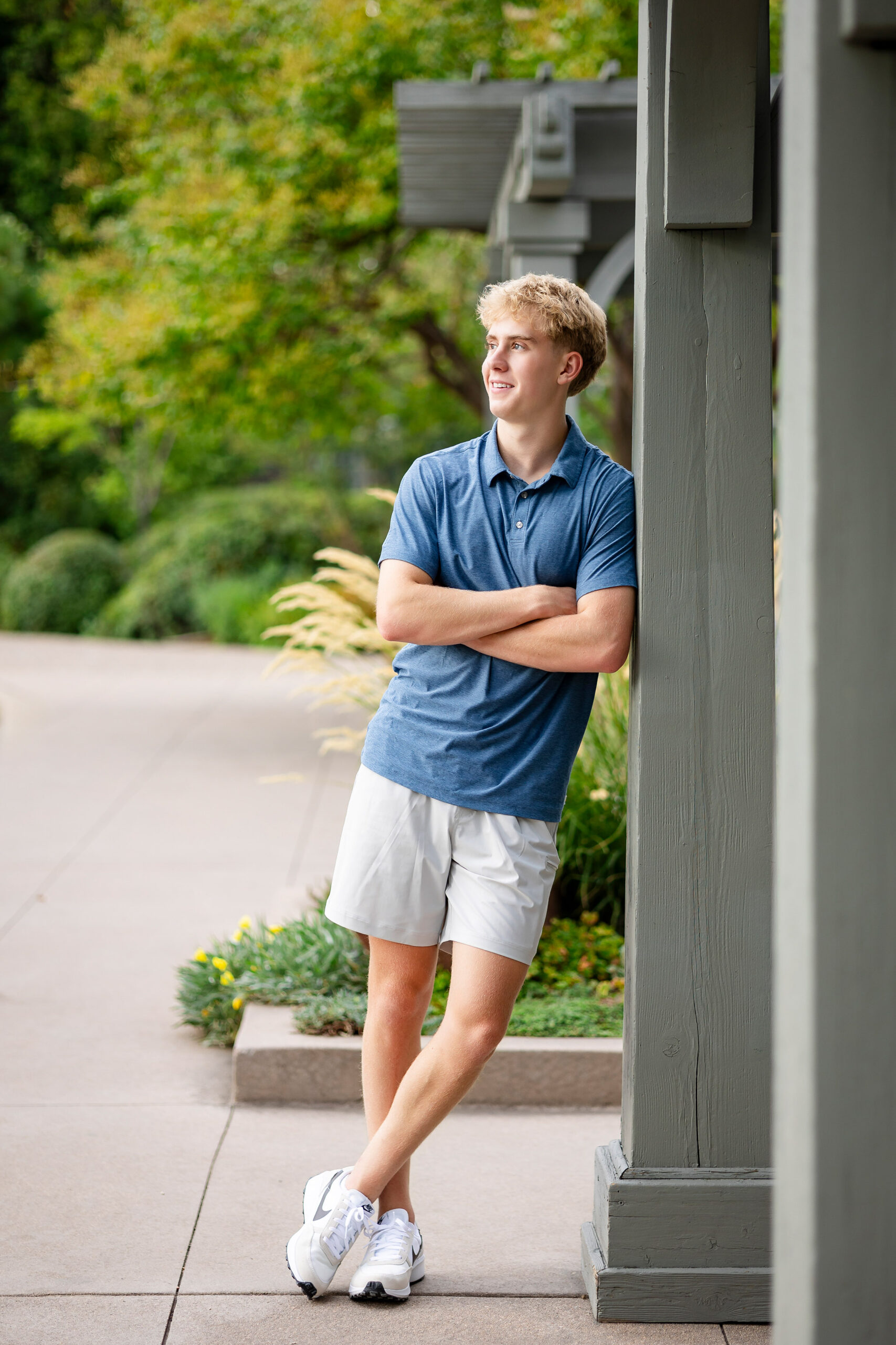 senior guy posing for portraits at Denver Botanic Gardens