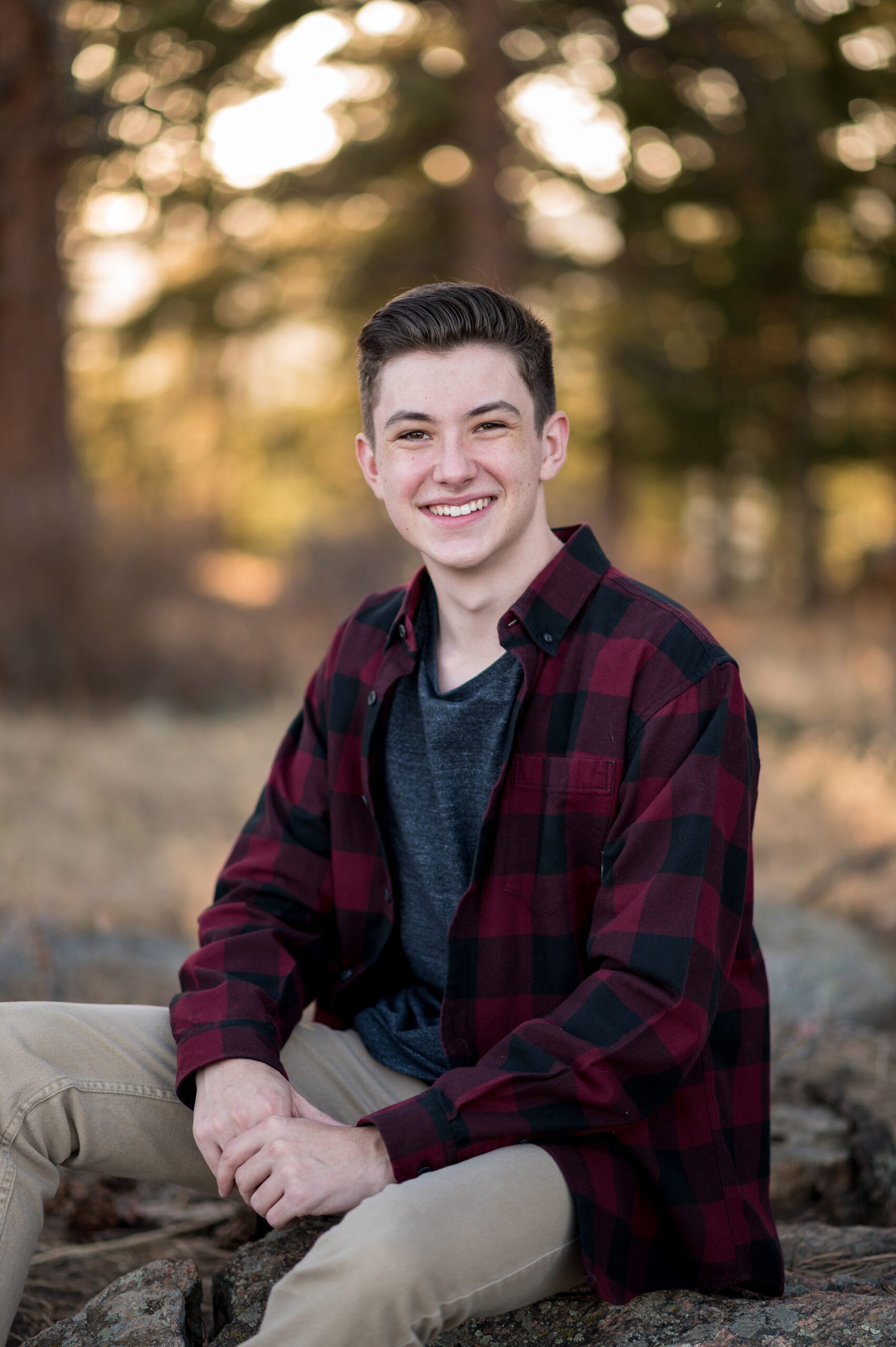 High school senior guy in red flannel in colorado