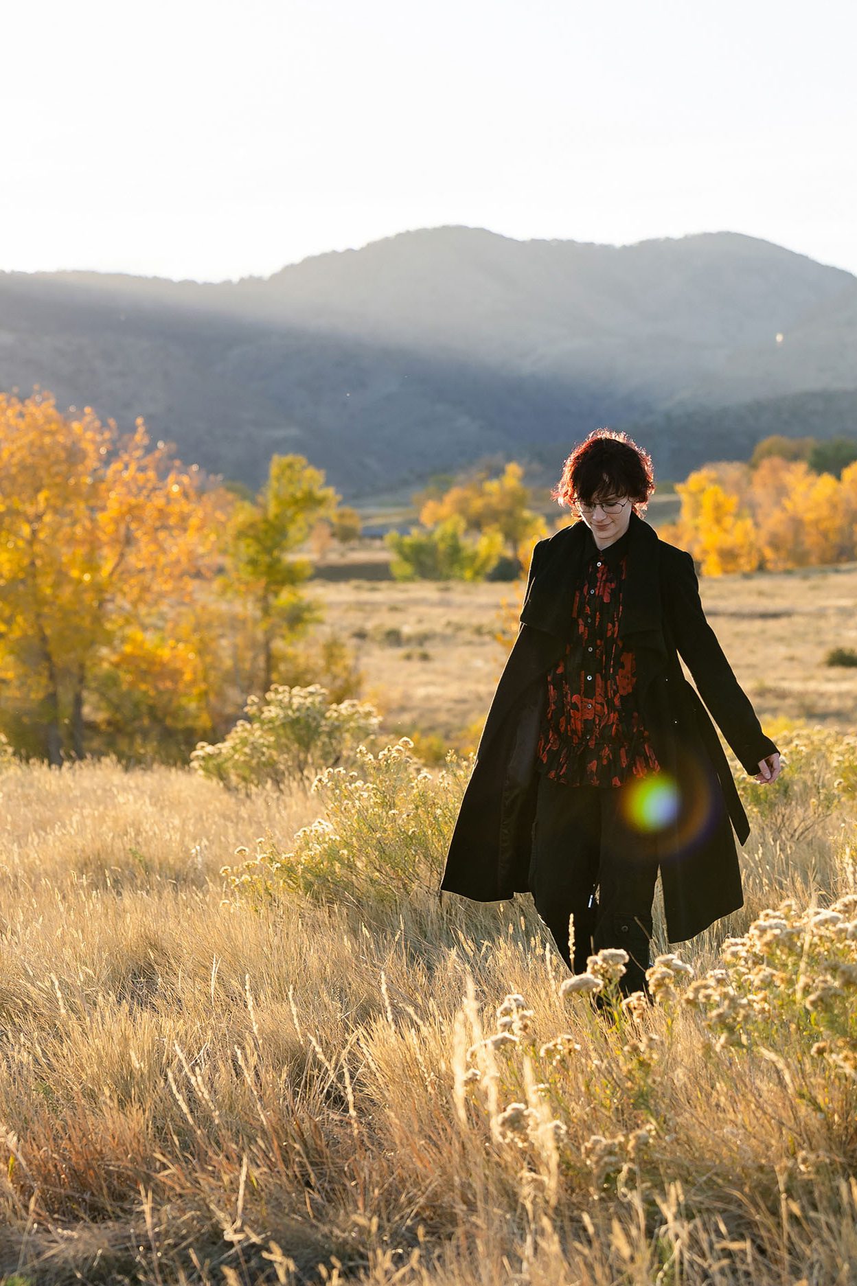 Senior walking in a long coat for an elevated fall photo photo look